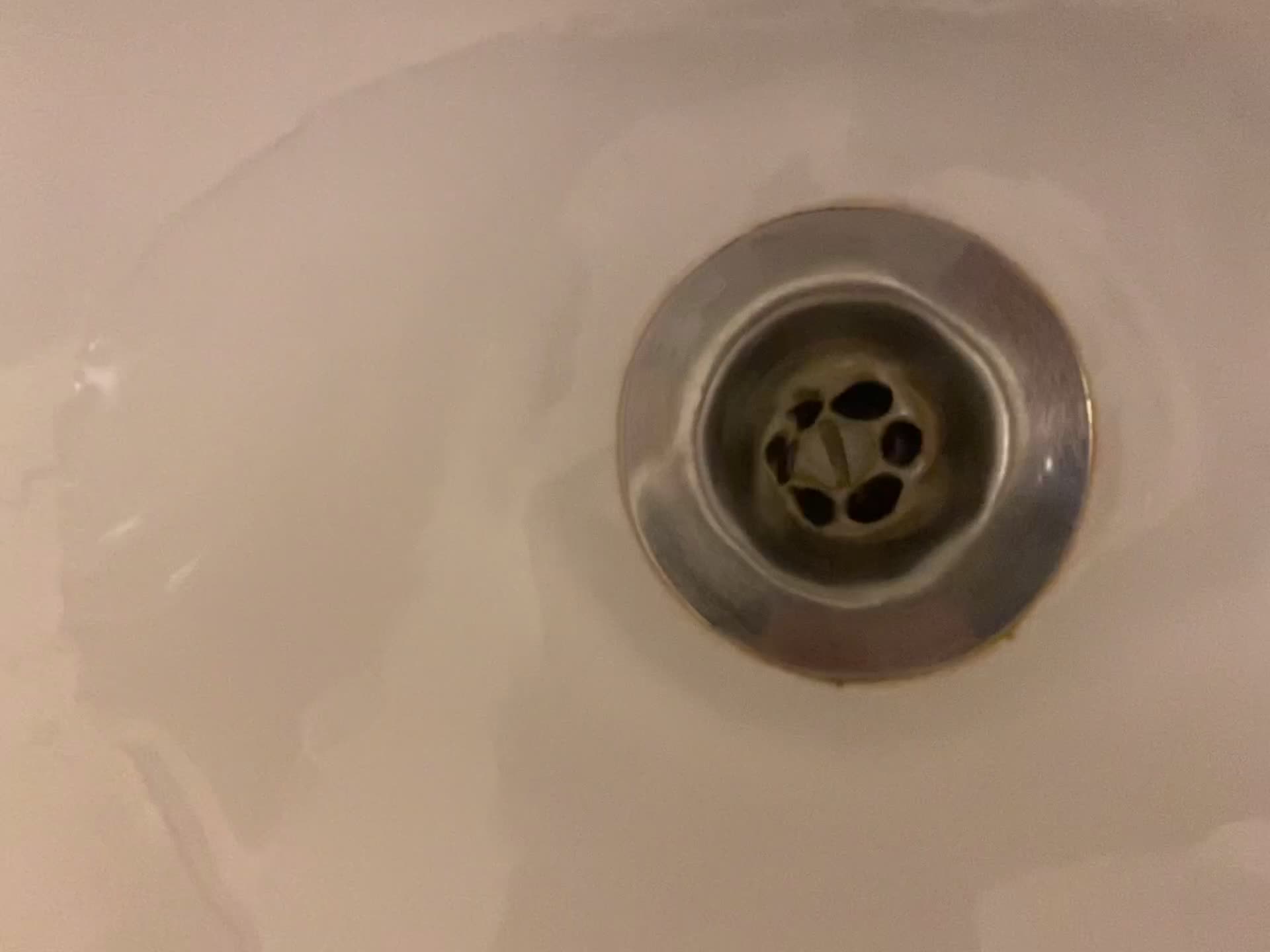 Small plughole in sink